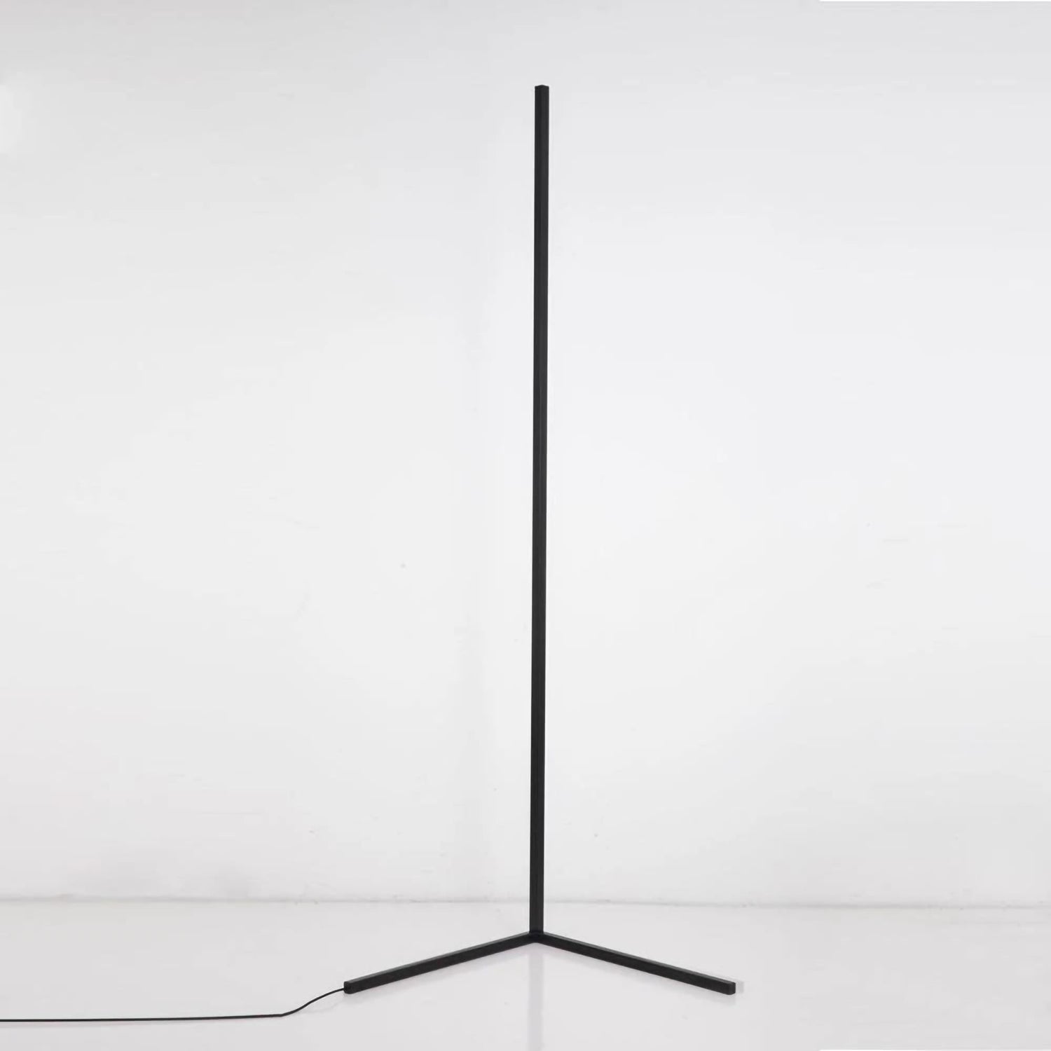 Minimalist Corner RGB floor lamp, unlit showing Y shaped black base.