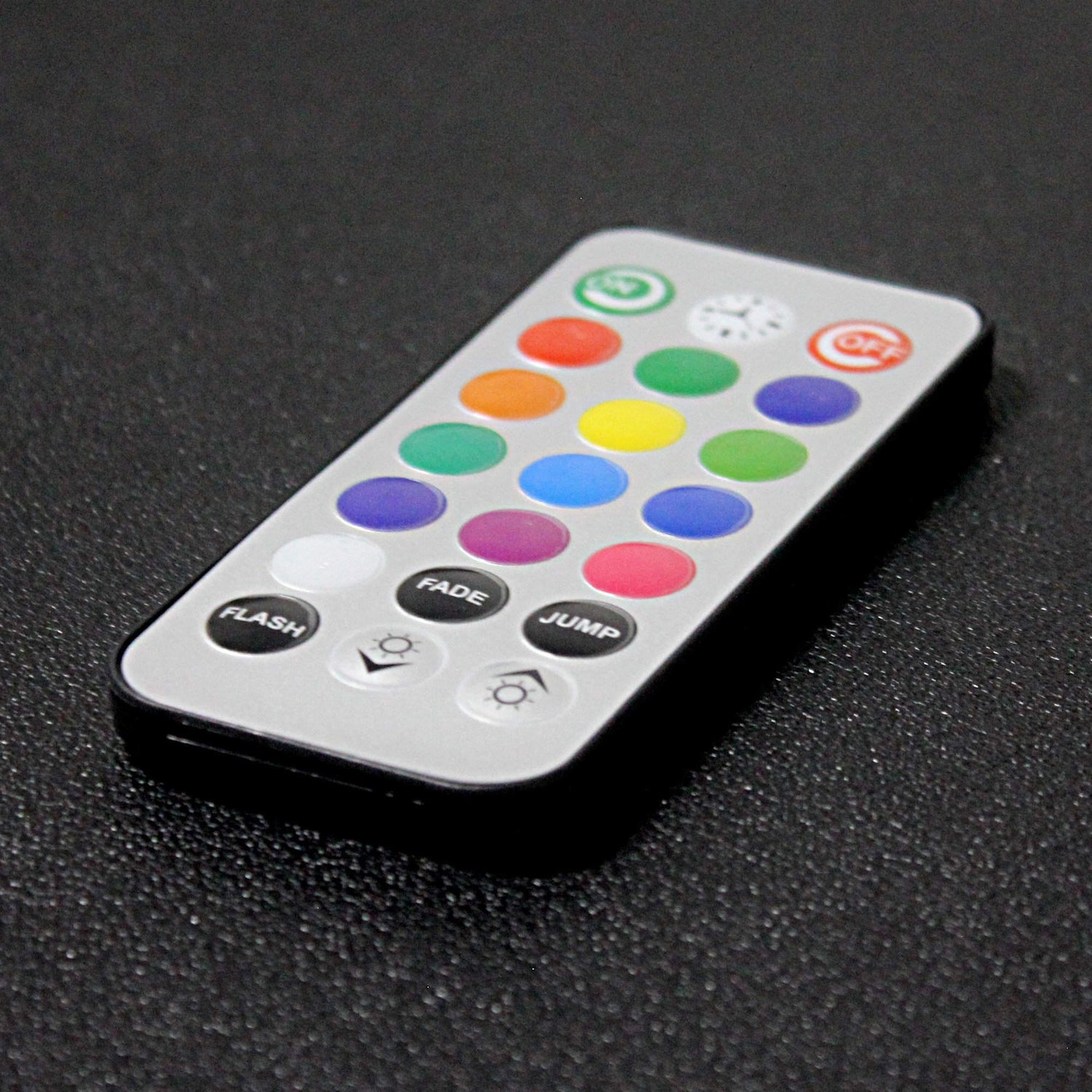 Close up of remote control unit for Touch Sensitive Honeycomb Wall Lights, showing color, flash, fade, and jump buttons.