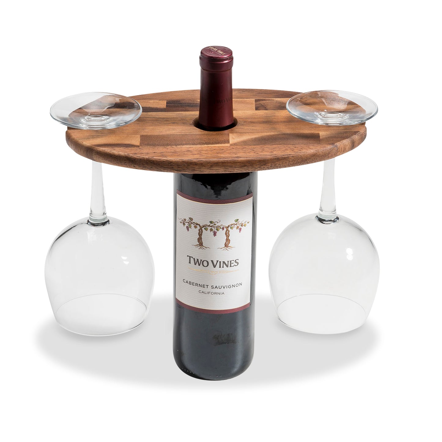 Wooden wine bottle caddy shown atop wine bottle, holding two steamed wine glasses.