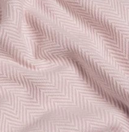 	Chevron patterned Turkish hand towel in light pink with gentle ripples in fabric.