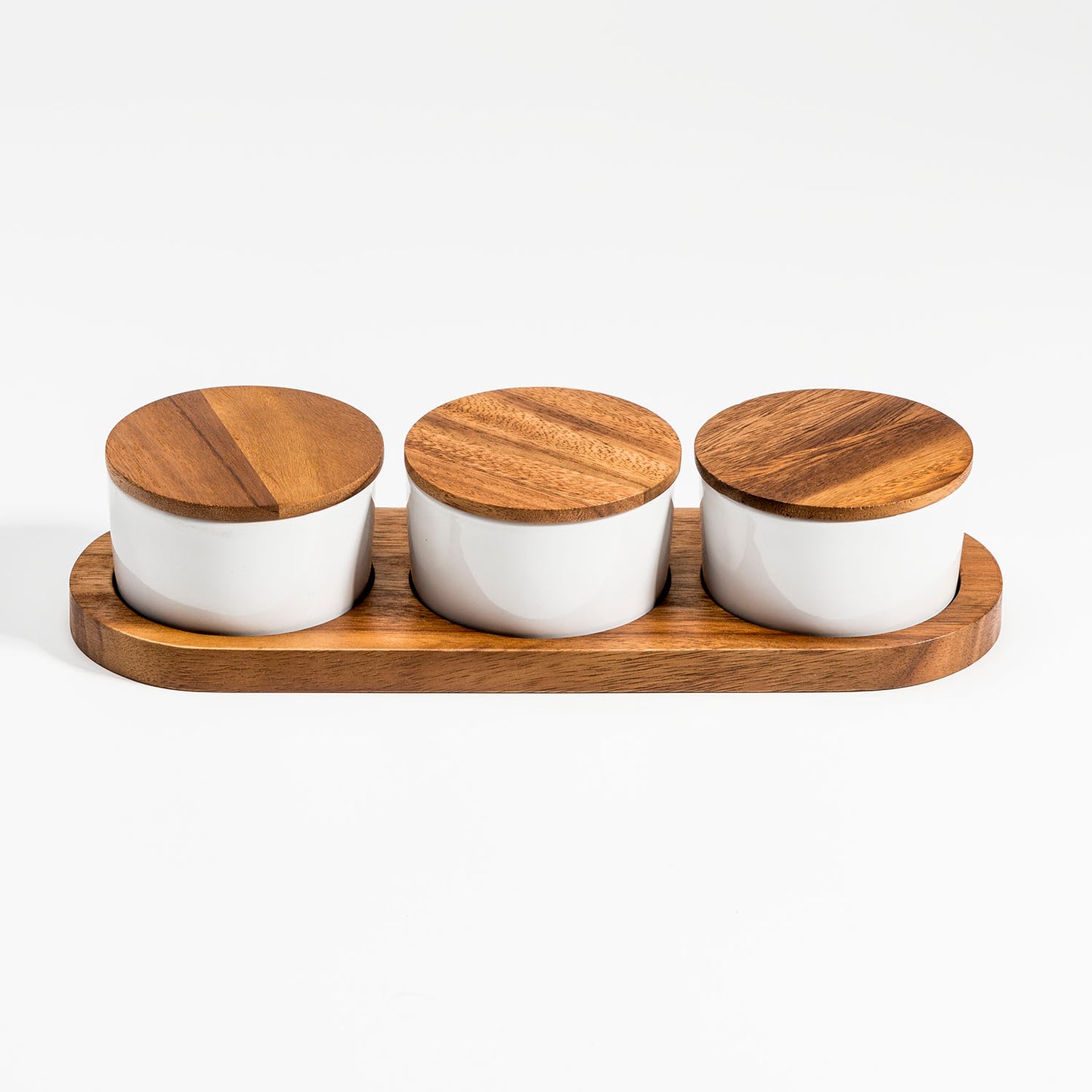 Three Piece Condiment Serving Set, made from natural colored acacia Wood & white Ceramic, shown with lids on