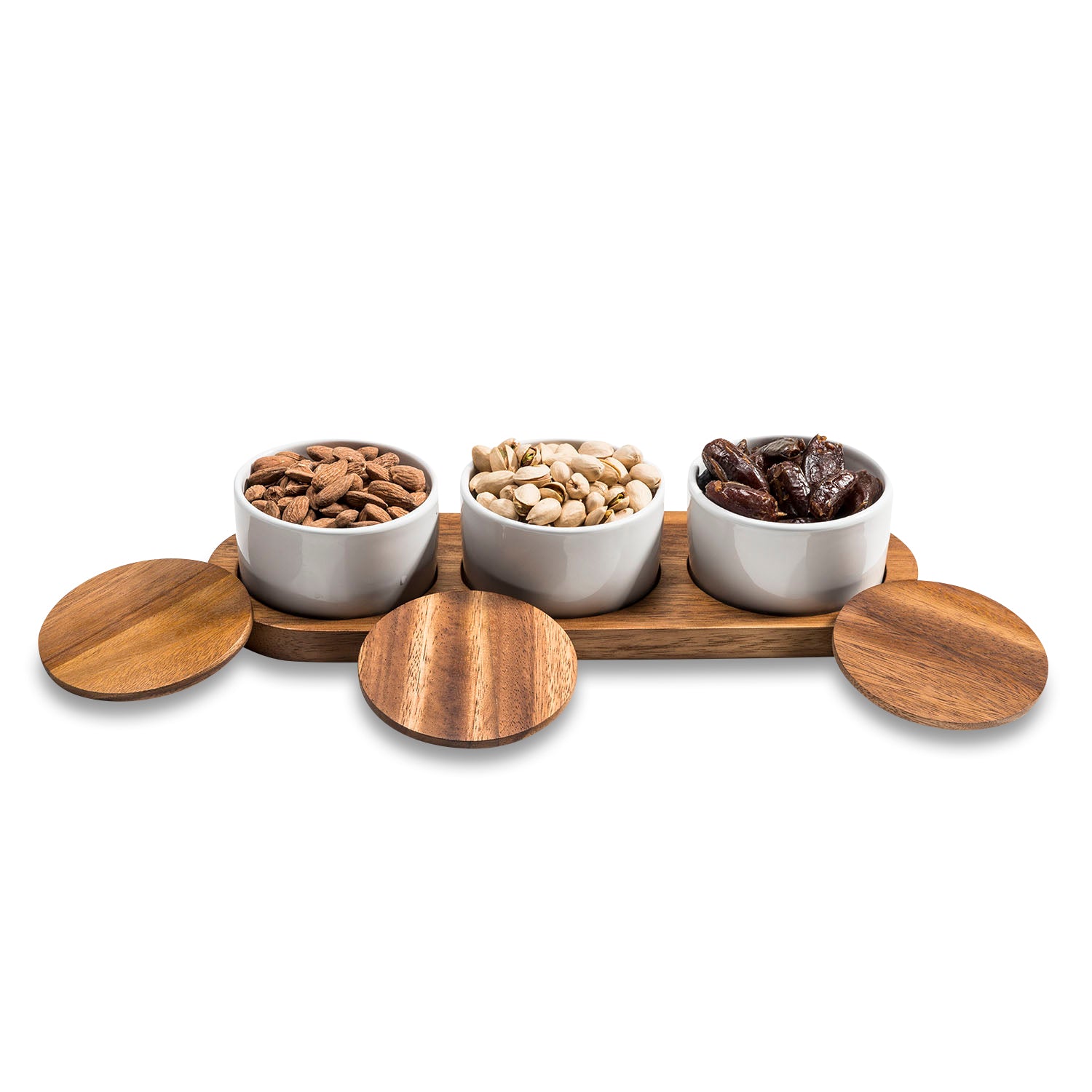 Three Piece Condiment Serving Set, made from acacia Wood & white Ceramic, shown with lids off, filled with nuts, on holder.